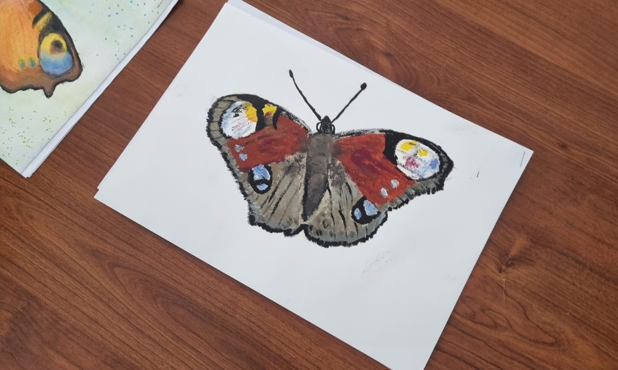 Rysunek motyla narysowany przez dziecko